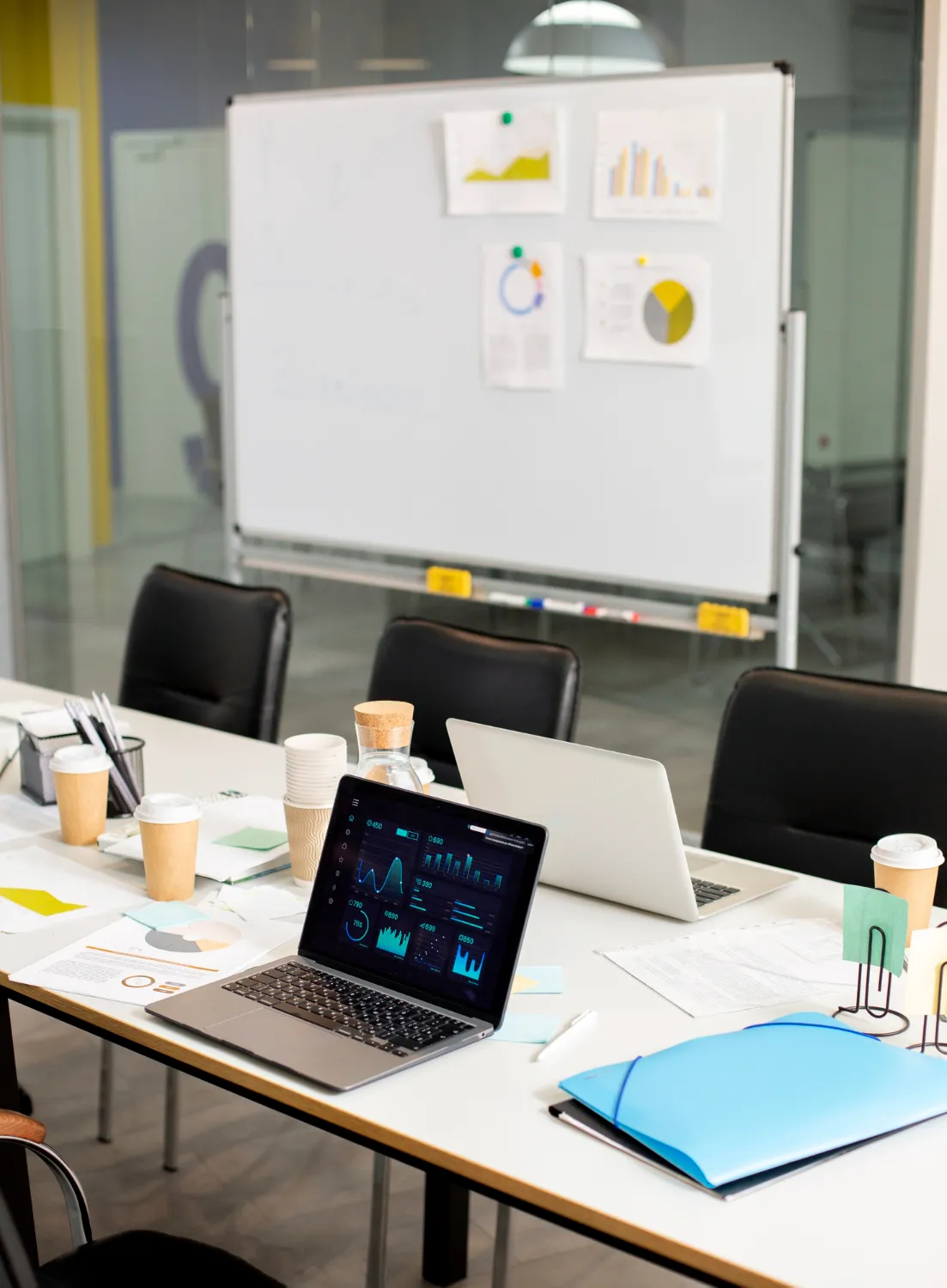 Contemporary marketing agency meeting room setup with KPIs on display